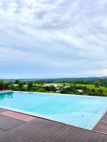 a large swimming pool on top of a building at Golden Palm Apartment with overlooking view in Port Vila