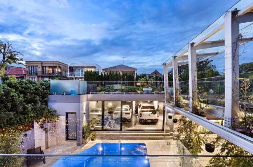 an aerial view of a house with a swimming pool at Luxury 6beds Waterfront Retreat in Sydney