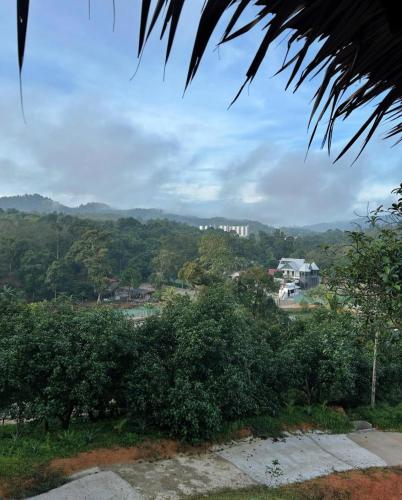 a view of a town with trees and houses at Maju Farm House in Hulu Langat