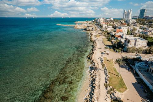 an aerial view of a beach and the ocean at Pool & Jacuzzi Seaview Penthouse by Sea N' Rent in Haifa