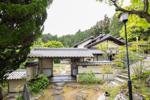 a house in the middle of a forest at Villa璃都りーと Villa Retreat in Ibaraki