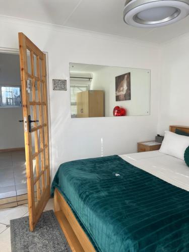 Ένα ή περισσότερα κρεβάτια σε δωμάτιο στο EasyStay Hideaway