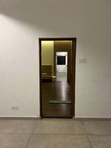 a hallway with a door leading to a room at Maju Farm House in Hulu Langat