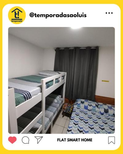 a small bedroom with a bunk bed and a bunk bedskirts at Flat Smart Home in São Luís