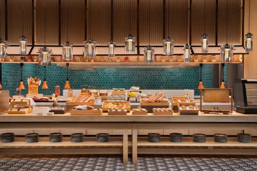 a bakery with many different types of food on display at Four Points by Sheraton Suzhou Gusu in Suzhou