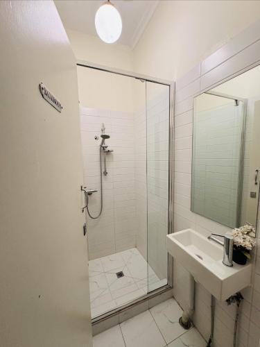 a bathroom with a shower and a sink at 96B - Central Comfy Great Value - ST Kilda in Melbourne