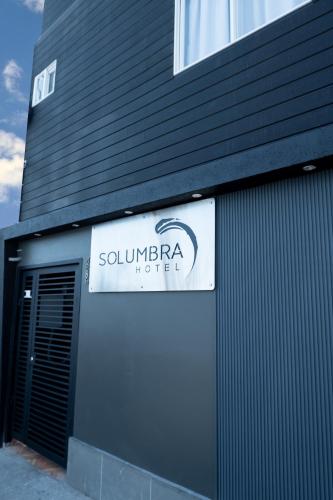 a sign on the side of a building at Hotel Solumbra in Antofagasta