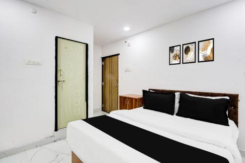 Ένα ή περισσότερα κρεβάτια σε δωμάτιο στο Hotel O Green Light Inn