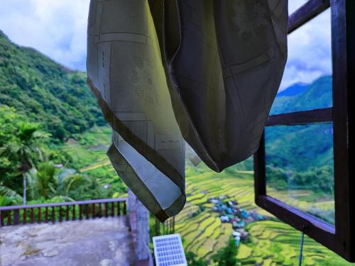 a view from a room with a view of a mountain at BATAD Simons Viewpoint Inn and Pizza Restaurant in Banaue