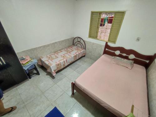a room with a bed and a couch and a table at Acomoda 7 pessoas tranquilo casa temporada São João in Caruaru