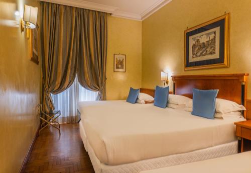 Postel nebo postele na pokoji v ubytování Hotel Miami