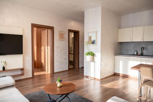 a living room with a couch and a table at Villa Dunaj 2 in Dunajská Streda