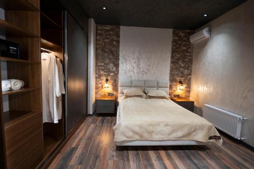a bedroom with a large bed and two night stands at Luxury Beachfront Villa with Indoor Pool & BBQ in Baku