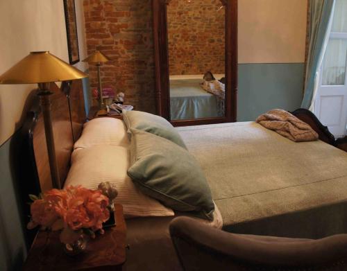Postel nebo postele na pokoji v ubytování Casa Dellatorre