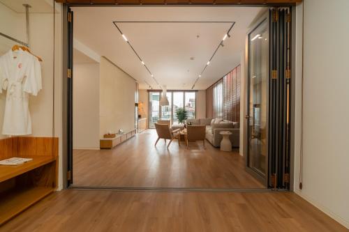 an open hallway with a living room and dining room at Colline Dalat in Da Lat