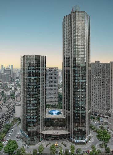 two tall skyscrapers in a city with at Kempinski Hotel Changsha in Changsha