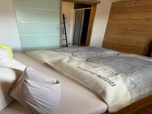a large bed in a room with at House in Zell am Ziller with Panoramic Views in Zell am Ziller