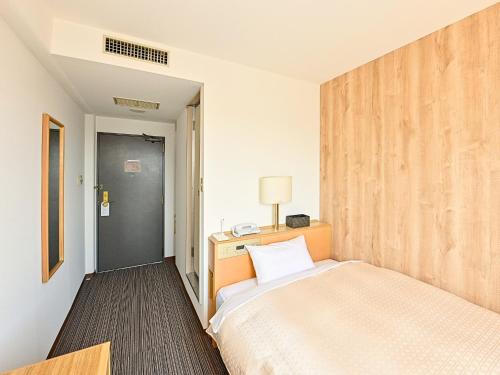 Ένα ή περισσότερα κρεβάτια σε δωμάτιο στο Park Hotel Kani