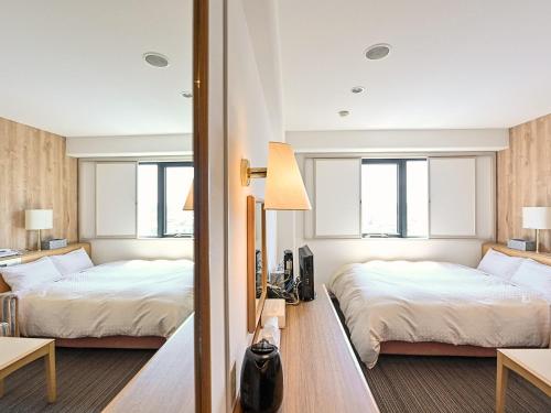 Ένα ή περισσότερα κρεβάτια σε δωμάτιο στο Park Hotel Kani