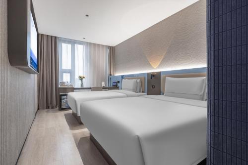 Postel nebo postele na pokoji v ubytování Atour Light Hotel Beijing West Station North Square