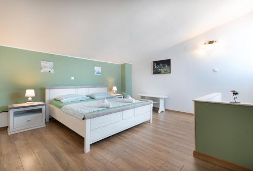 Postel nebo postele na pokoji v ubytování Villa Bepina