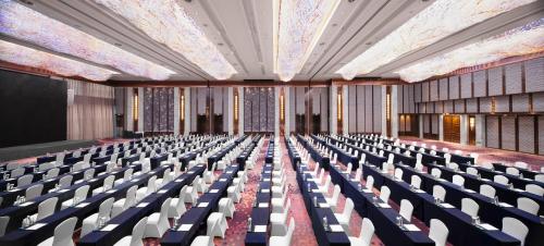 an empty lecture hall with chairs and a stage at Kempinski Hotel Changsha in Changsha