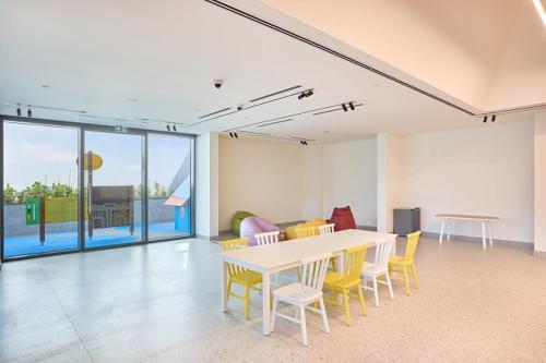 a dining room with a table and chairs in a room at STAY BY LATINEM Luxury 1BR Holiday Home CVG 1803 near Burj Khalifa in Dubai