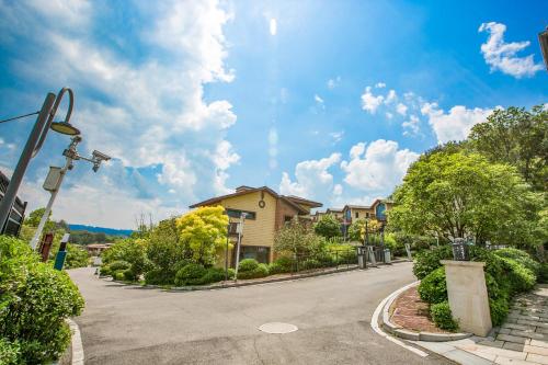 an empty street in a residential neighborhood with houses at Avatar Valley Villas in Zhangjiajie