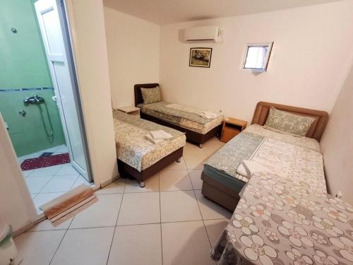 Katil atau katil-katil dalam bilik di AS MONTENEGRO SUITES