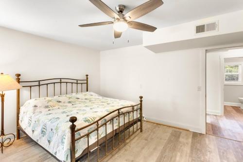 a bedroom with a bed and a ceiling fan at 3018 - Celestial Mermaid in Southern Shores