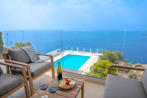 a living room with a view of a swimming pool at Ocean views from every corner in Almería