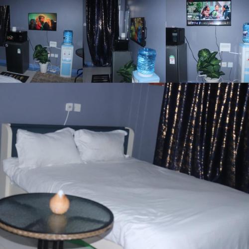 a bedroom with a bed with a table on it at The Loft & Found in Nairobi