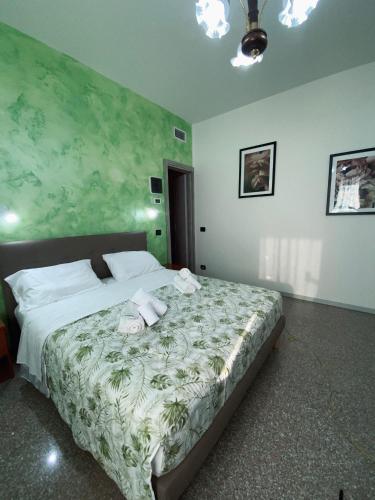 a bedroom with a large bed with towels on it at Madonna dell'ancora in Sassuolo