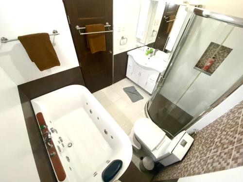 a bathroom with a sink and a toilet and a shower at Lalaguna Villas Luxury Dive Resort and Spa in Puerto Galera
