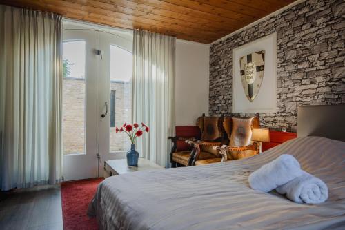 Postel nebo postele na pokoji v ubytování Hotel Vesting Bourtange