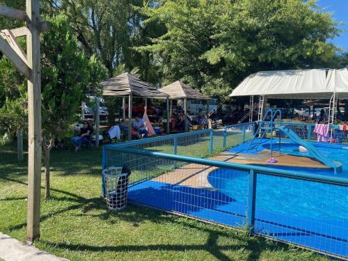 a swimming pool with a slide and a playground at Rancho Benjamín Salazar in San Clemente