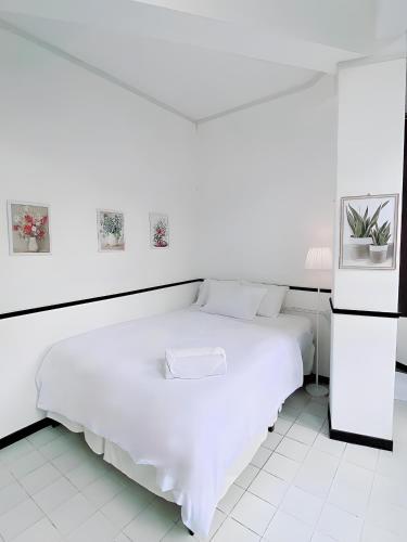Ένα ή περισσότερα κρεβάτια σε δωμάτιο στο GO INN Hua Lamphong - โกอินน์ หัวลำโพง
