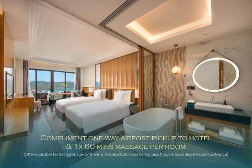 a rendering of a hotel room with two beds and a sink at Grand Hyams Hotel - Quy Nhon Beach in Quy Nhon