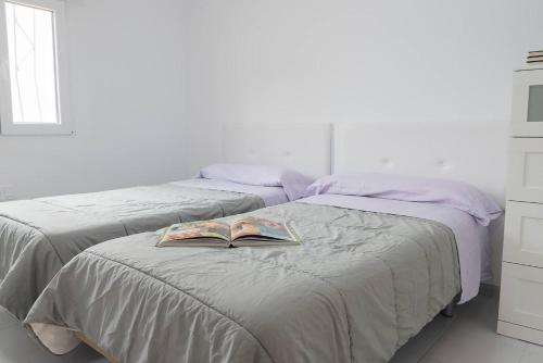 En eller flere senge i et værelse på Casa en Almería