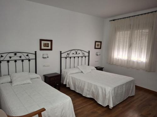 Katil atau katil-katil dalam bilik di Hostal Rural El Padul