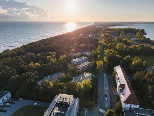 an aerial view of a city and the ocean at Rewita Rogowo k Kołobrzegu in Rogowo