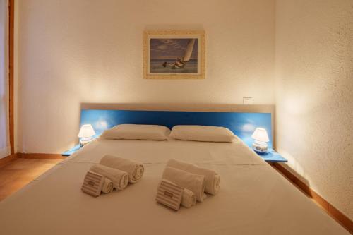 Postel nebo postele na pokoji v ubytování Cugnana Nest