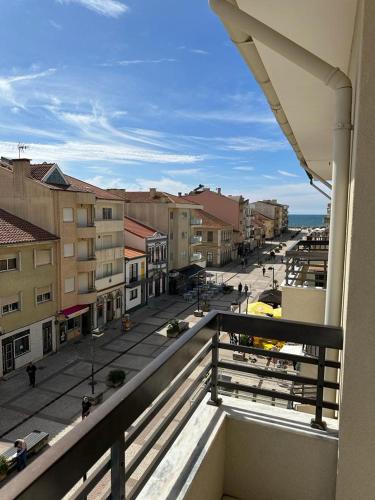 a view of a city street from a balcony at Apartamento da praia in Ovar