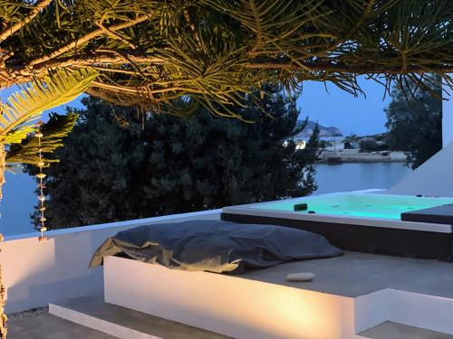 a view of a swimming pool from a house at Eos Milos House in Pollonia