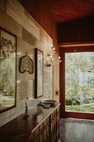 a room with a counter and a large window at Villa Desirè in Salò