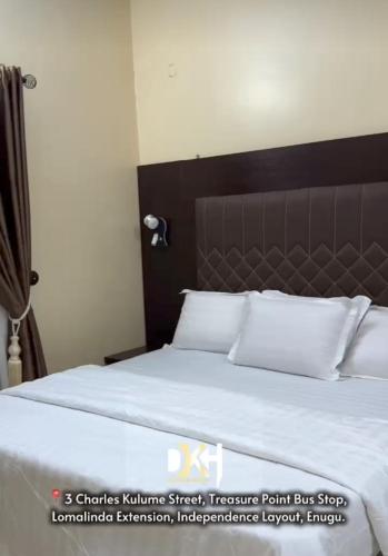 Postel nebo postele na pokoji v ubytování Daokem Hotel & Suite