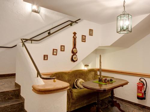 a living room with a couch and a table at Gasthaus & Hotel "Zum Boarn" in Rain