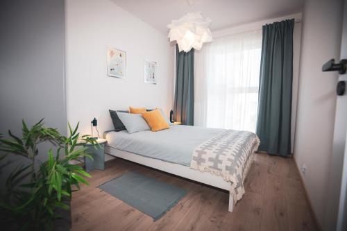 Postel nebo postele na pokoji v ubytování Apartament Strzelców 4