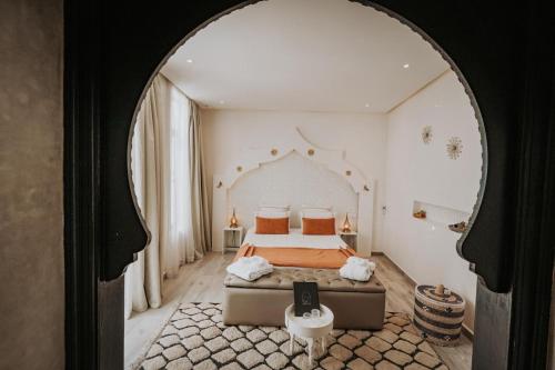 a bedroom with a bed in an archway at RIAD NOLITA & SPA Kasbah in Marrakesh