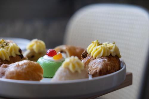 a plate of pastries sitting on a table at Domus Terravecchia in Agrigento